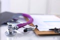 Medical stethoscope lying on a computer keyboard, cup of coffee Royalty Free Stock Photo