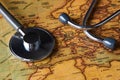 Medical stethoscope over Europe healthcheck. close-up map