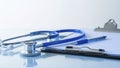 Medical Stethoscope and Pen on Desk Royalty Free Stock Photo