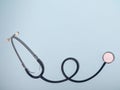 Medical stethoscope or phonendoscope  isolated on light blue background. Close-up of a stethoscope. flat lay. Royalty Free Stock Photo