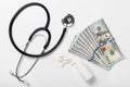 Medical stethoscope pills and money on white background Royalty Free Stock Photo