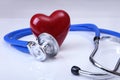 Medical stethoscope and red heart isolated on white Royalty Free Stock Photo