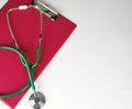 medical stethoscope and red paper holder Royalty Free Stock Photo