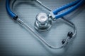 Medical stethoscope on striped background Royalty Free Stock Photo