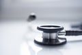 Medical stethoscope on white blur background with copy space inside hospital.