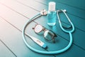 Medical still life with women glasses, digital thermometer and stethoscope and sanitizer. Concept of career and training in a
