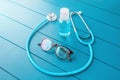 Medical still life with womens glasses, stethoscope and sanitizer. Concept of career and training in a hospital for a doctor