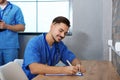 Medical student with groupmate in library Royalty Free Stock Photo