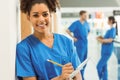 Medical student taking notes in hallway Royalty Free Stock Photo