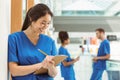 Medical student taking notes in hallway Royalty Free Stock Photo