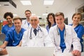 Medical students and professor using laptop Royalty Free Stock Photo