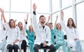 Medical students raising their hands during the seminar. Royalty Free Stock Photo