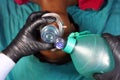 Medical stuff in black gloves performing Artificial ventilation using bag valve mask Ambu bag on a simulation mannequin dummy Royalty Free Stock Photo