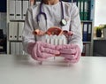 Medical suppositories and female uterus in hands of doctor