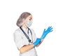 Medical surgeon doctor womanisolated on wihte. Doctor putting on sterile gloves. Place for medical advertise. Medical Royalty Free Stock Photo