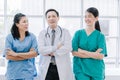 Medical surgeon team of young people looking at camera with determination and confidence in the hospital Royalty Free Stock Photo