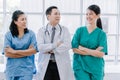 Medical surgeon team of young people looking at camera with determination and confidence in the hospital, teamwork concept in cari Royalty Free Stock Photo