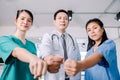 Medical surgeon team of young people looking at camera with determination and confidence in the hospital, teamwork concept in Royalty Free Stock Photo