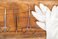Medical, surgical instruments, equipment and rubber gloves on wooden background Royalty Free Stock Photo