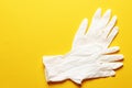 Medical Surgical Sterile Gloves on a colored background