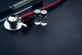 Medical swab, vials and stethoscope closeup on black background