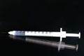 Medical Syringe with Abstract Reflection depicting the Covid-19 Vaccination.