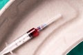 Medical syringe, bloodsample lying in a one use capsule Royalty Free Stock Photo