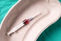 Medical syringe, bloodsample lying in a one use capsule Royalty Free Stock Photo