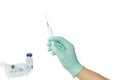 Medical syringe in a male hand wearing a medical glove Royalty Free Stock Photo
