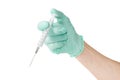 Medical syringe in a male hand wearing a medical glove