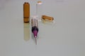 Medical syringe and needle on ampules background Royalty Free Stock Photo