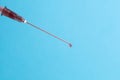 medical syringe needle and drop of blood Royalty Free Stock Photo