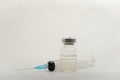 A medical syringe recruits a vaccine from an ampoule