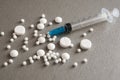 The medical syringe, thermometer and tablets are on the table Royalty Free Stock Photo
