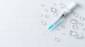 Medical syringe with water drops on white surface Royalty Free Stock Photo