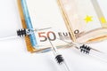 Medical syringes on wad of several euro banknotes bills Royalty Free Stock Photo