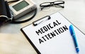 Medical table with tonometer. Clip-on label. Lettering MEDICAL ATTENTION. Health care concept Royalty Free Stock Photo