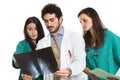 Medical team with bearded doctor and female surgeons with stethoscope control x-ray. Doctors staff. Caucasian. Isolated on white.