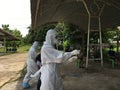 Medical team conduct COVID-19 coronavirus Rapid test PCR test ,cover in PPE suit, CDCU team Buriram province, Thailand