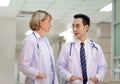 Medical team discussing in the corridor at hospital, team of mixed-races doctors, Group of multi ethnic medics, men and women Royalty Free Stock Photo