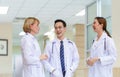 Medical team discussing in the corridor at hospital, team of mixed-races doctors, Group of multi ethnic medics, men and women Royalty Free Stock Photo