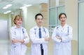 Medical team discussing in the corridor at hospital, team of mixed-races doctors, Group of multi ethnic medics, men and women Royalty Free Stock Photo