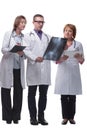 Medical team discussing diagnosis of x-ray image Royalty Free Stock Photo