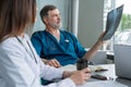 Medical Team Discussing Treatment Options With Patients. Team of doctors having a meeting in the meeting room. Royalty Free Stock Photo