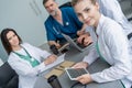 Medical Team Discussing Treatment Options With Patients. Team of doctors having a meeting in the meeting room. Royalty Free Stock Photo