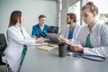 Medical Team Discussing Treatment Options With Patients. Team of doctors having a meeting in the meeting room. Royalty Free Stock Photo