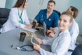 Medical Team Discussing Treatment Options With Patients. Team of doctors having a meeting in the meeting room. Royalty Free Stock Photo