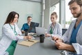 Medical Team Discussing Treatment Options With Patients. Team of doctors having a meeting in the meeting room. Royalty Free Stock Photo