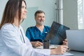 Medical Team Discussing Treatment Options With Patients. Team of doctors having a meeting in the meeting room. Royalty Free Stock Photo