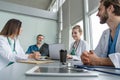 Medical Team Discussing Treatment Options With Patients. Team of doctors having a meeting in the meeting room. Royalty Free Stock Photo